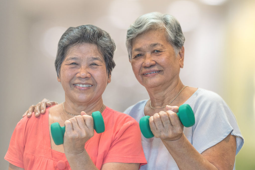 Senior women using their muscles
